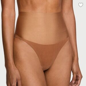 2 Victoria's Secret Body By VICTORIA
SmoothingShimmer™ Thong Panties.